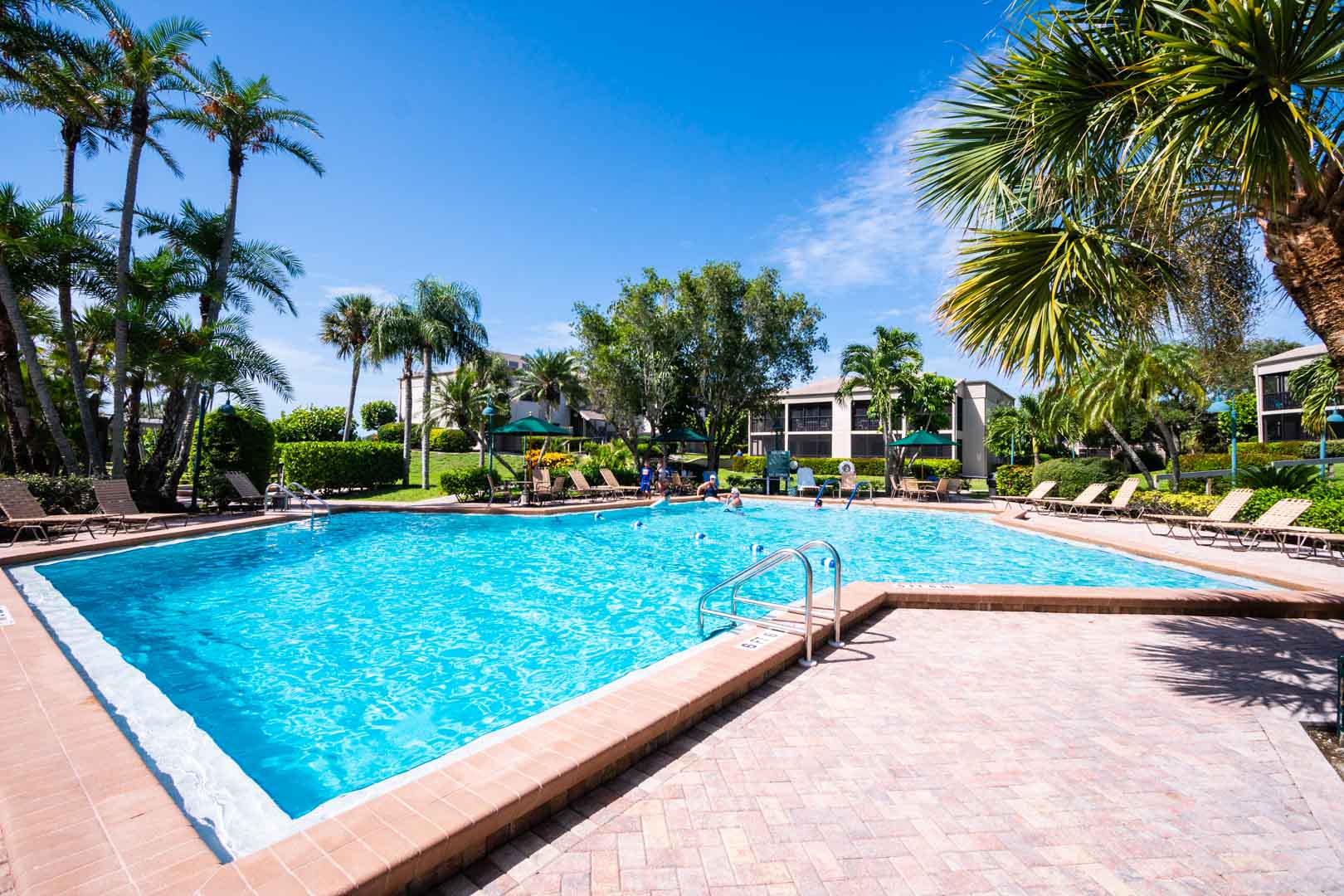 A crisp and clean outdoor swimming pool at VRI's Sanibel Beach Club in Sanibel Island, Florida.